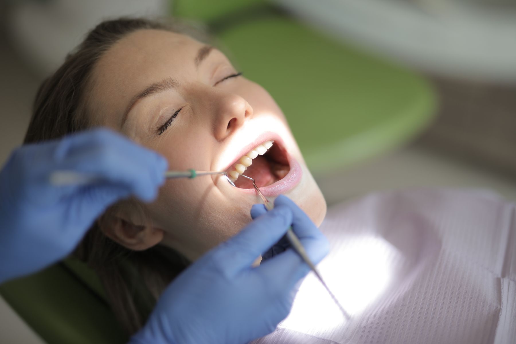 Patient in a dental chair with a dentist